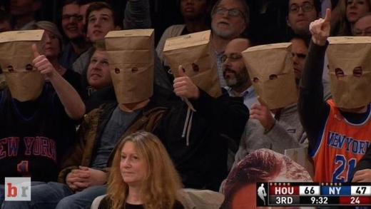 Knicks fans wear paper bags on their heads