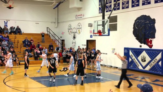 Bad luck: Buzzer beater gets stuck on the rim during Middle School game