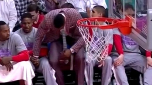 Awkward: Dwight Howard touches Isaiah Canaan in groin area