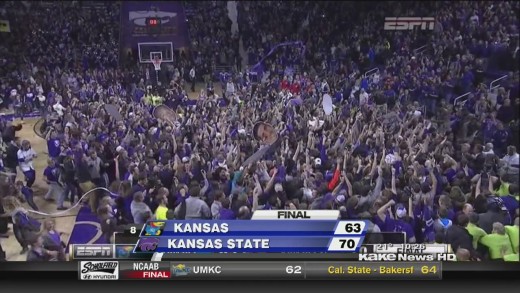 Kansas State court storms after a win versus rival Kansas