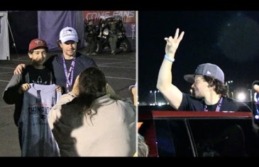 Mark Wahlberg gives a fan his Super Bowl hat after the game
