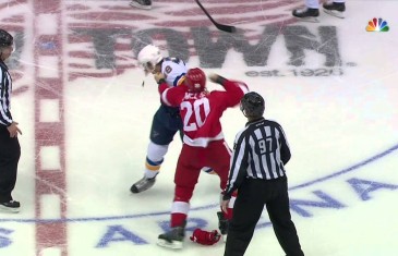Drew Miller appears to punch the St. Louis Blues logo off the helmet of Lindbohm