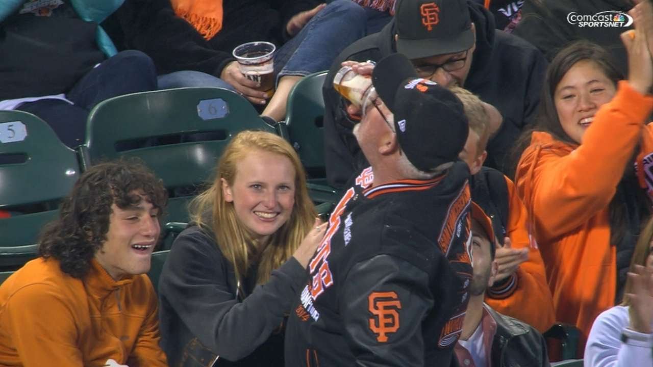 Ball lands in beer cup of Giants fan