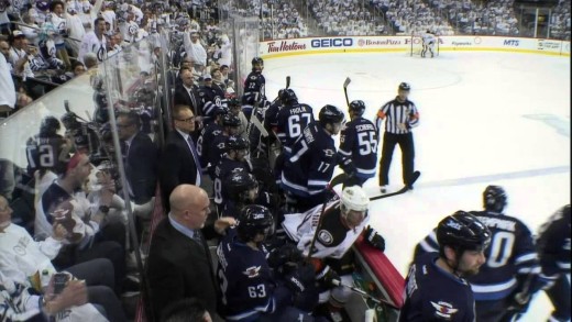 Byfuglien deposits Fleischmann into Jets bench