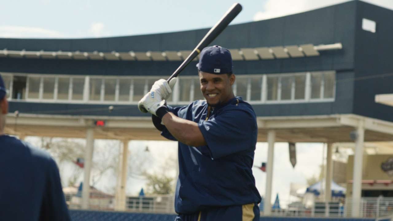 Carlos Gomez aims for the foul pole in soft toss