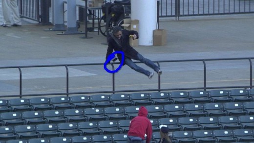 Determined fan ditches phone & beer for ball