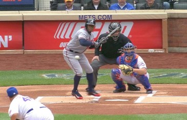 Eric Young Jr. bloops a bunt into the outfield