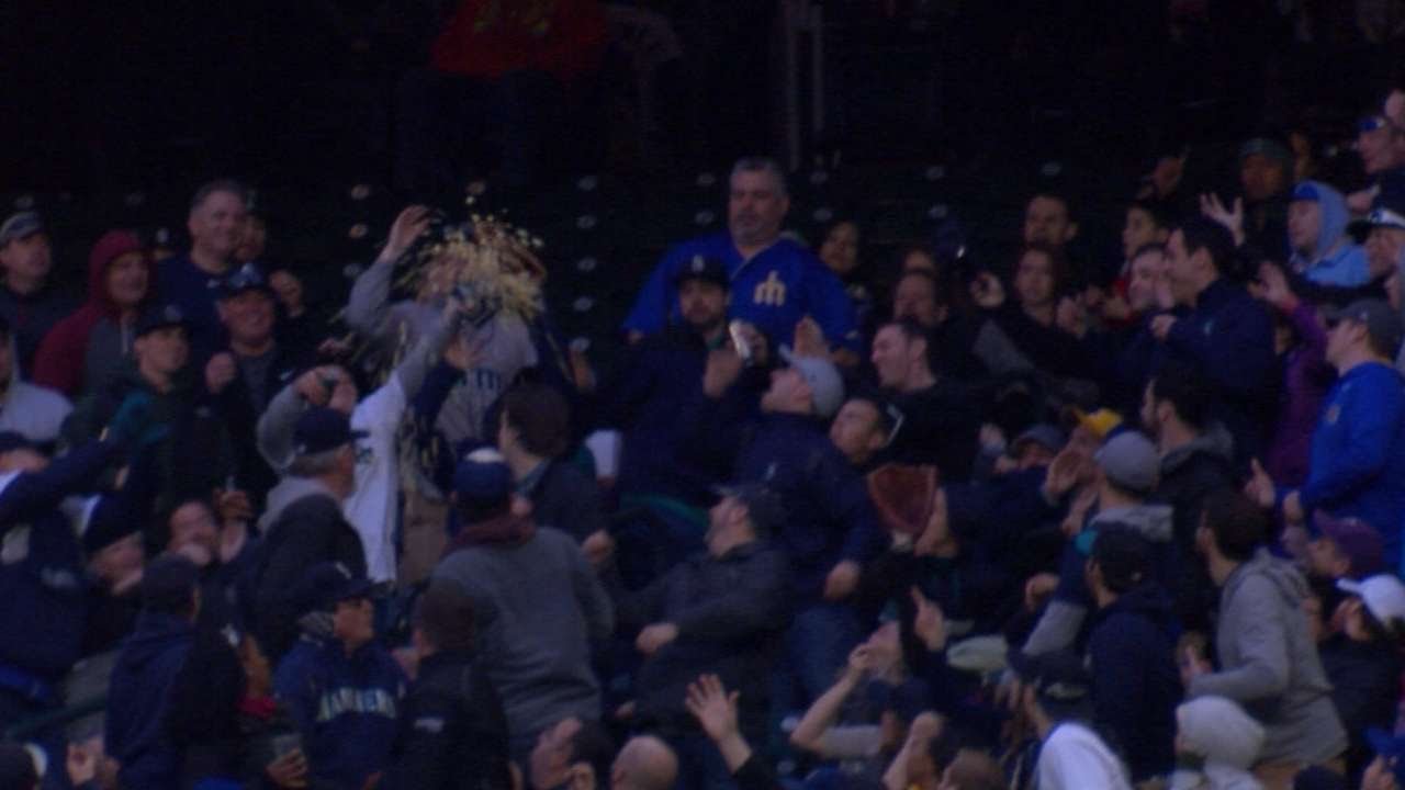 Fan snags a foul ball with bucket of popcorn
