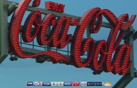 Jose Bautista breaks some light bulbs on the Coca-Cola sign