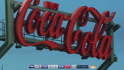 Jose Bautista breaks some light bulbs on the Coca-Cola sign