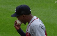 Julio Teheran bites baseball after walk to Cuddyer