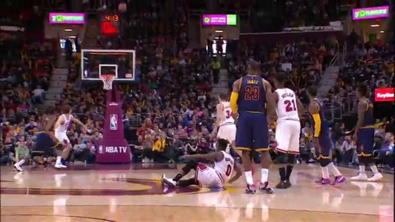 Kyrie Irving knocks down half court heave to beat the buzzer