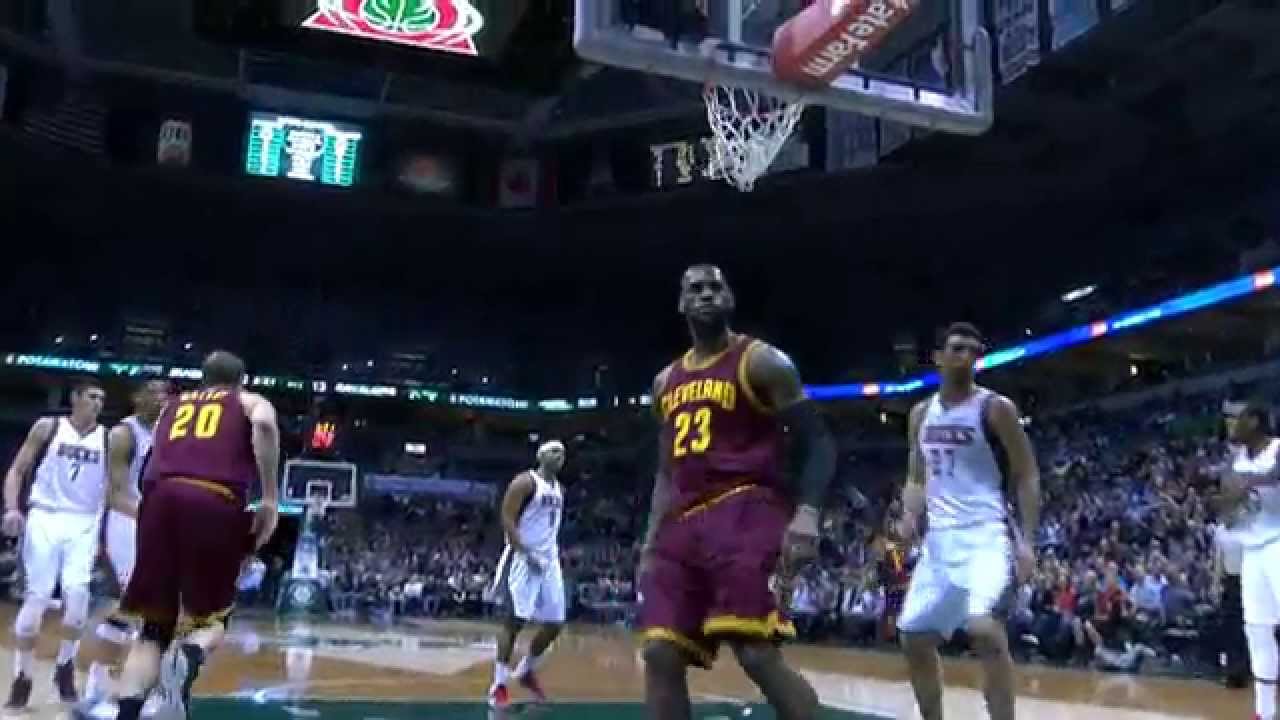 LeBron James throws down the slam from the no look Irving feed