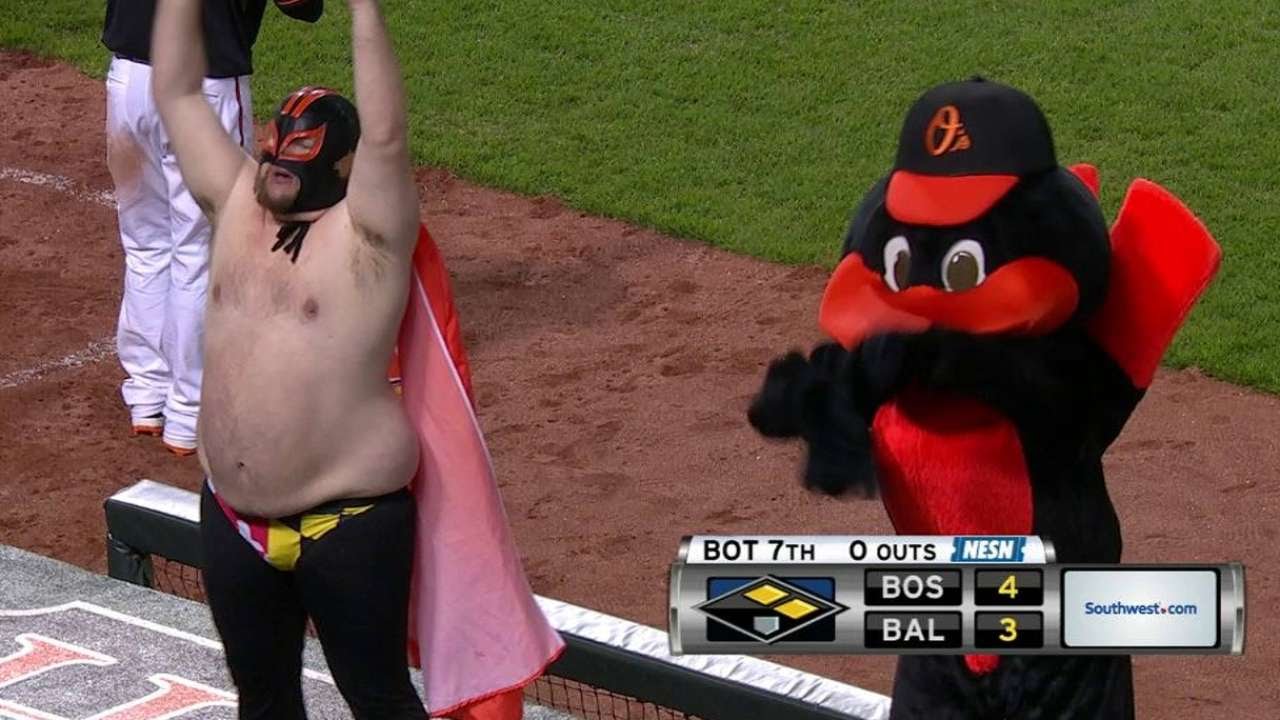 Masked man dances with The Oriole Bird