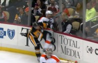 Pittsburgh Penguins forward Chris Kunitz knocks glass off from hit