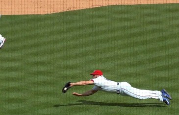 Rangers pitcher Anthony Bass makes a diving catch on a bunt