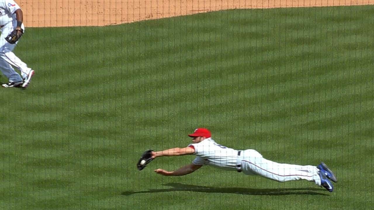 Rangers pitcher Anthony Bass makes a diving catch on a bunt