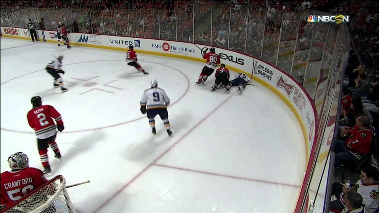 Ryan Reaves pulls a tooth out on the bench after taking a hit