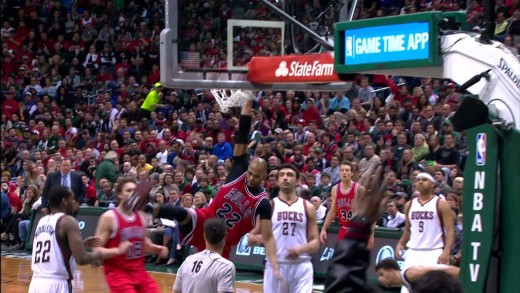 Taj Gibson throws down a hard slam