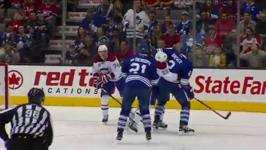 Toronto‘s Eric Brewer drops Alexei Emelin with a stiff arm