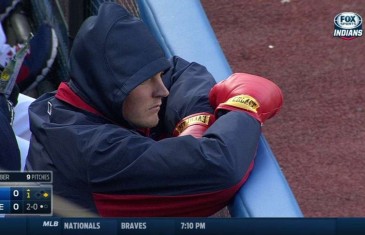 Trevor Bauer sports boxing gloves in dugout