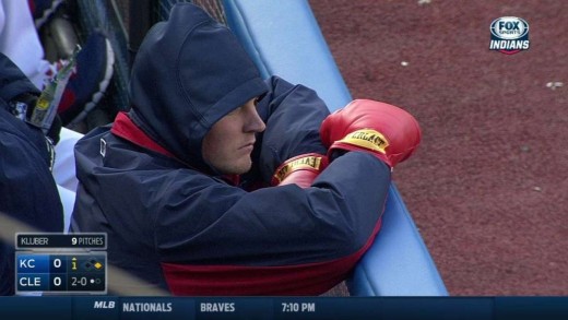 Trevor Bauer sports boxing gloves in dugout