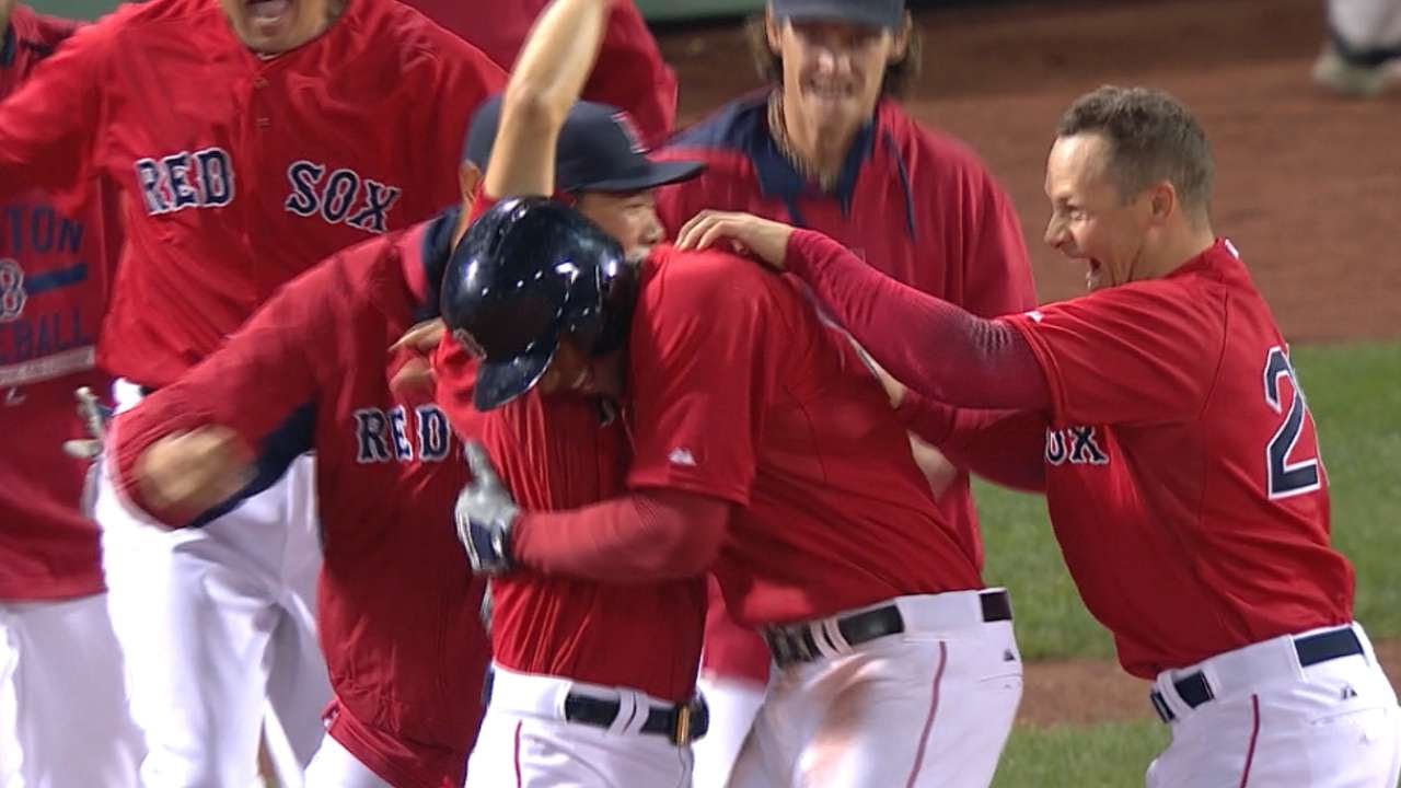 Xander Bogaerts hits a walk off flair shot for the Red Sox