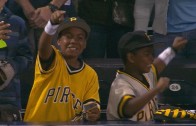 Andrew McCutchen gives his batting gloves to two young Pirates fans