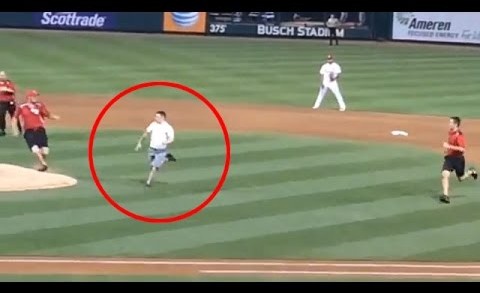 Baseball fan runs on the field & summersaults over home plate