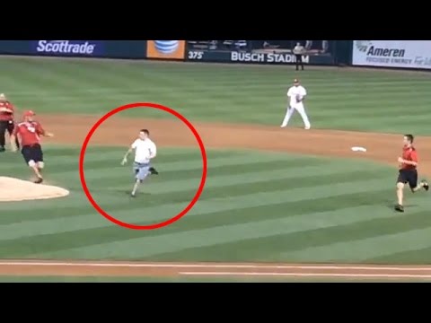 Baseball fan runs on the field & summersaults over home plate