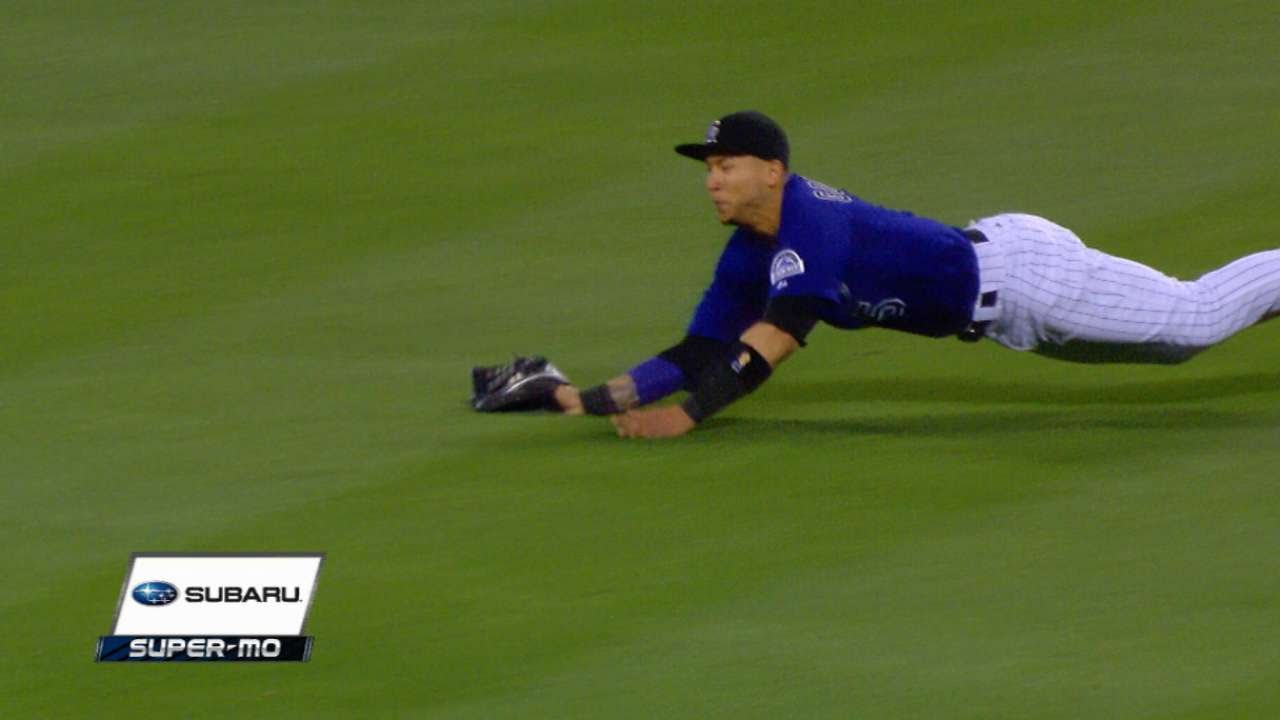 Carlos Gonzalez lays out to make an impressive grab