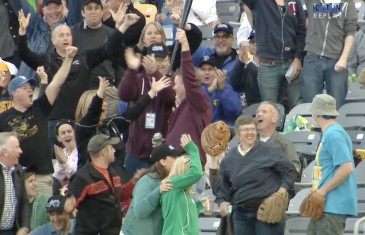 Fan makes impressive grab on bat flying into the stands