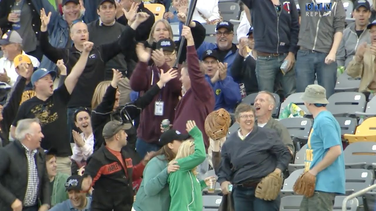 Fan makes impressive grab on bat flying into the stands