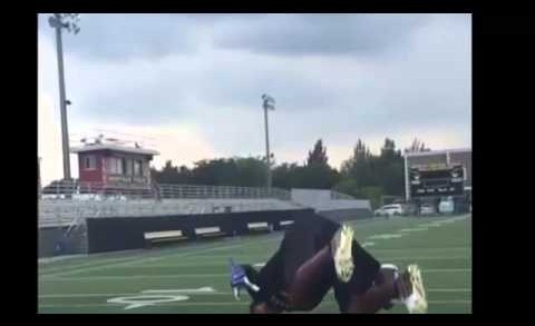 Four-star high school cornerback makes one handed back flip catch