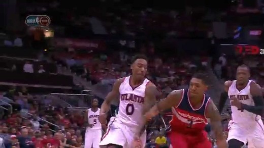 John Wall throws a blind over-head full court pass