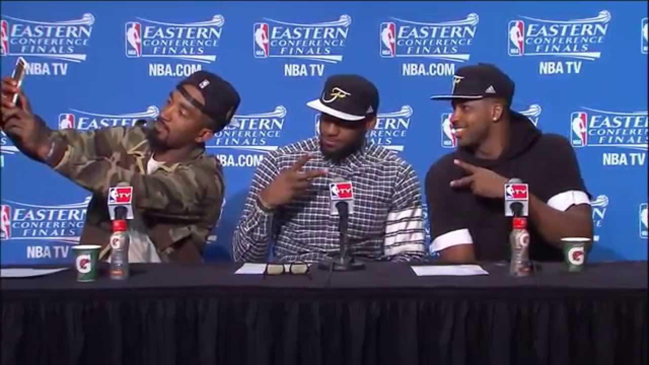 JR Smith takes a selfie during press conference with LeBron James