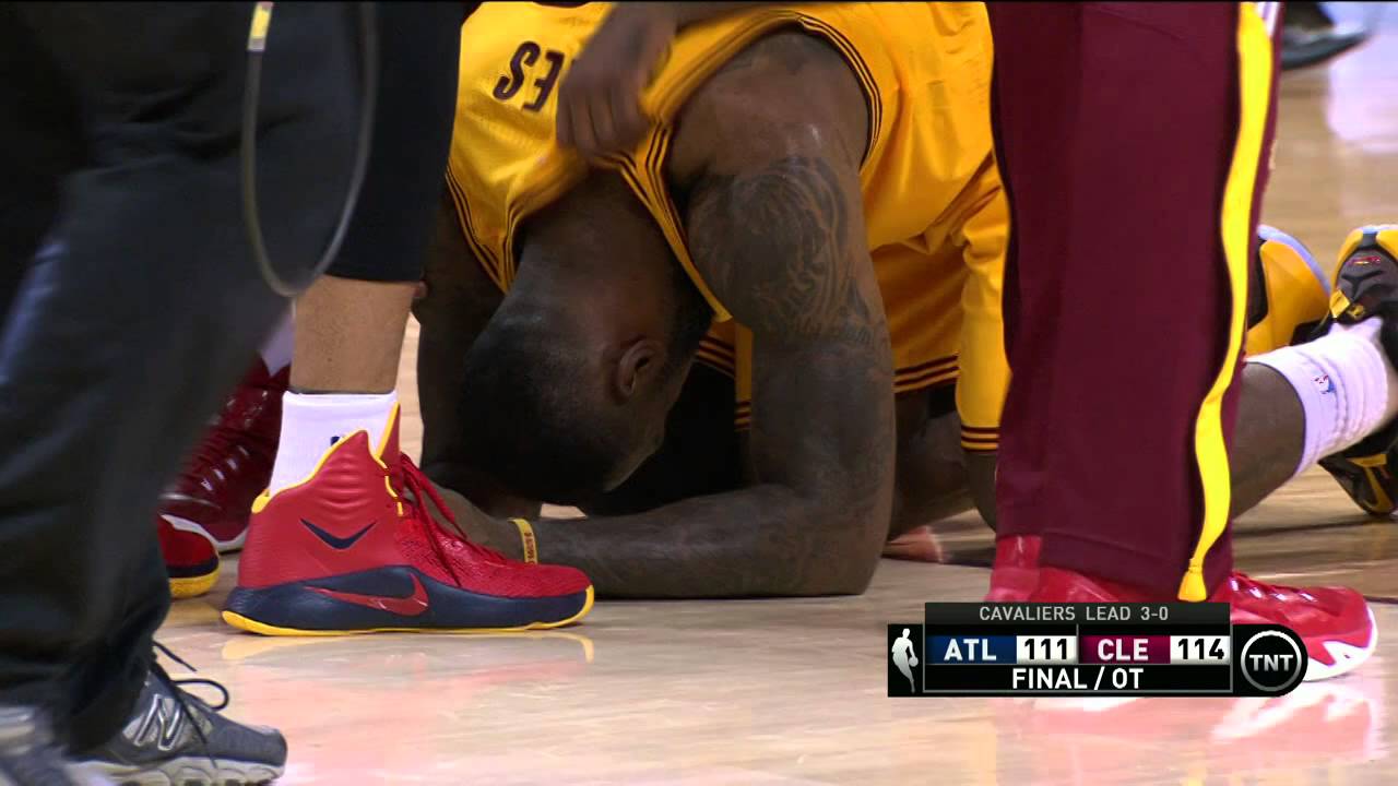 LeBron James falls to the floor after the Cavs win Game 3 in OT
