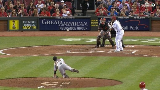 Tim Lincecum slips while throwing a pitch