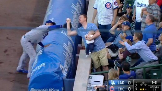 Fan robs Adrian Gonzalez with amazing catch of foul ball while holding baby