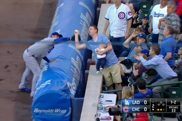 Fan robs Adrian Gonzalez with amazing catch of foul ball while holding baby