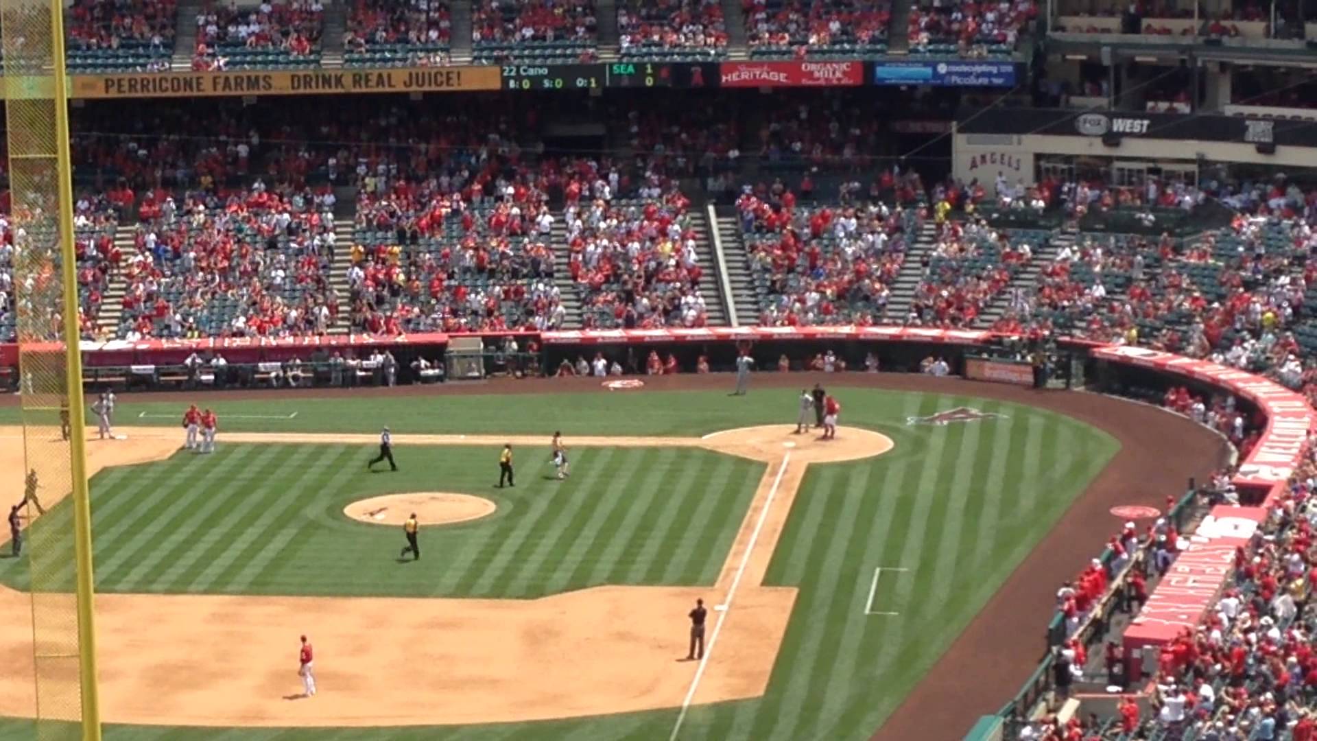 Fan runs onto field at Angels stadium & mimics a pitch