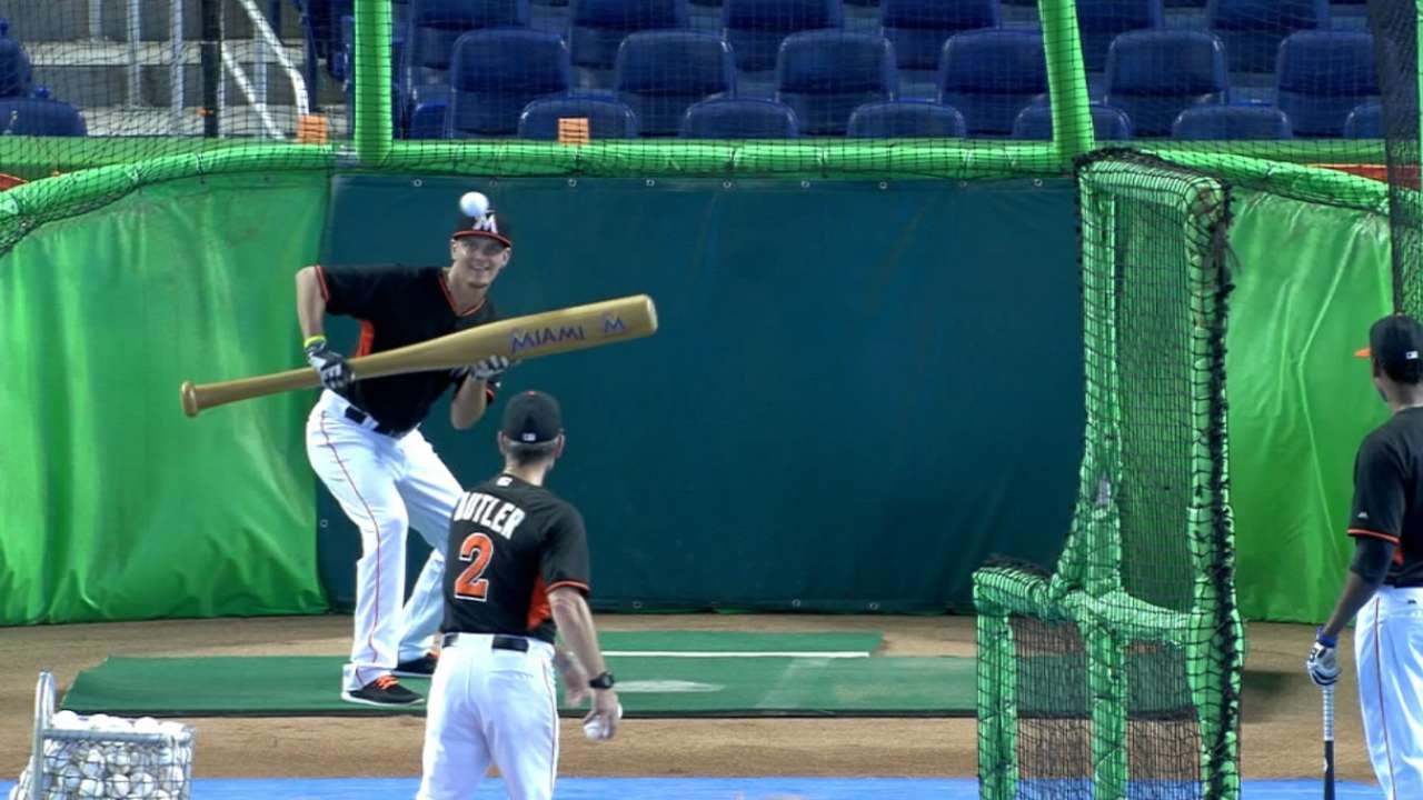 Justin Nicolino drops down bunts with giant bat