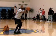LeBron James bangs a half court jumper with ease during practice