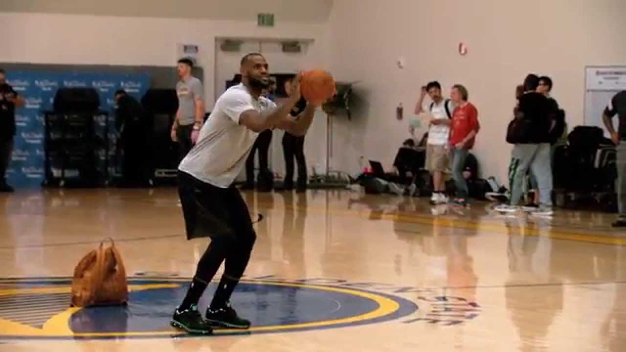 LeBron James bangs a half court jumper with ease during practice
