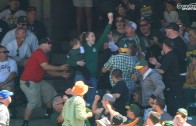 Oakland A’s fan catches foul ball while holding child