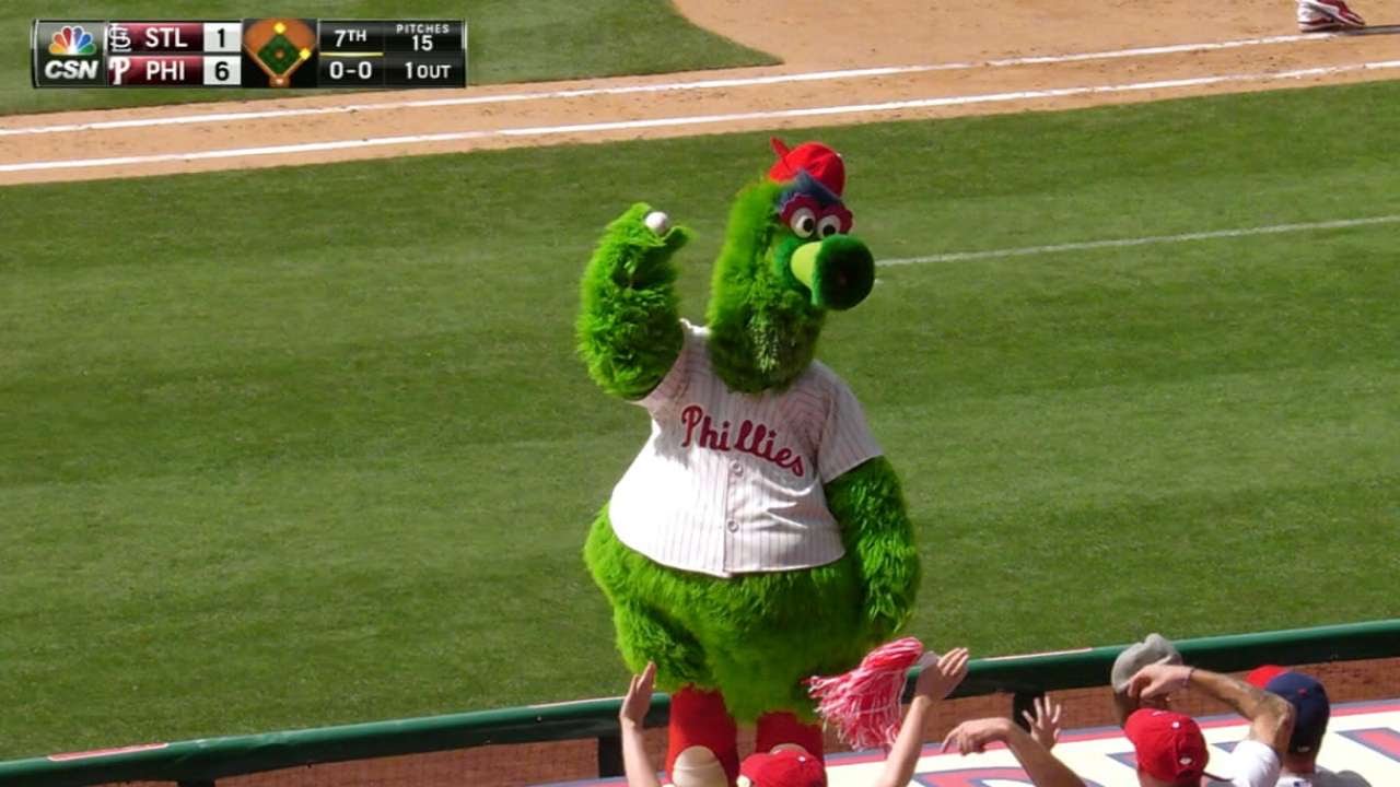 Phillie Phanatic dives on dugout to get foul ball