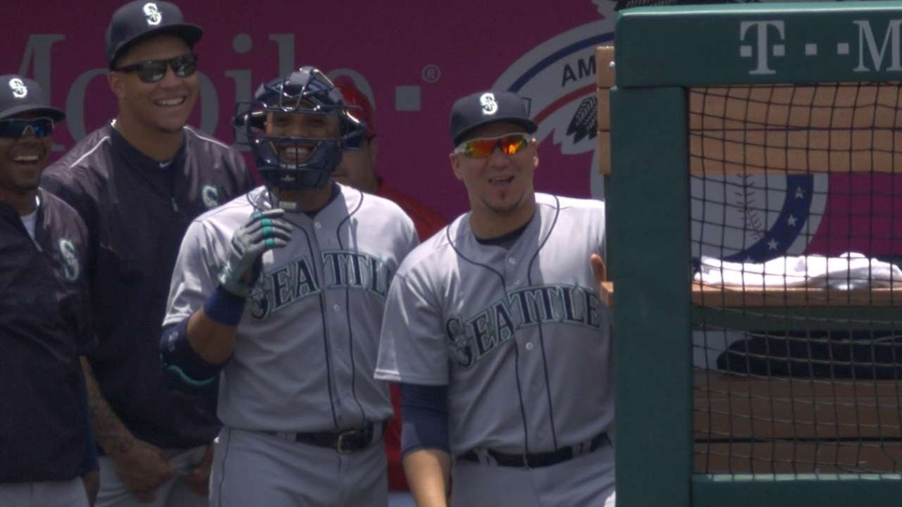 Robinson Cano jokingly wears catcher's mask in the dugout