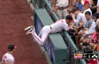 Ryan Flaherty smashes into the wall & reaches over railing to make catch
