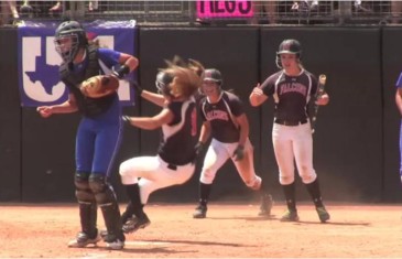 Women’s high school softball catcher levels players with her elbow