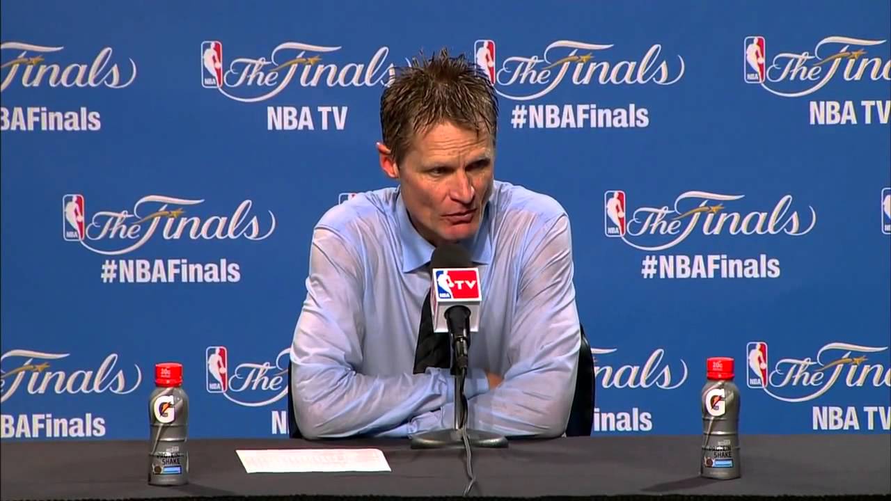 Steve Kerr covered in champagne for post game press conference